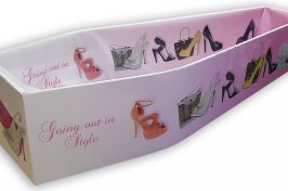 bespoke coffin with images of shoes on and 'going out in style' text